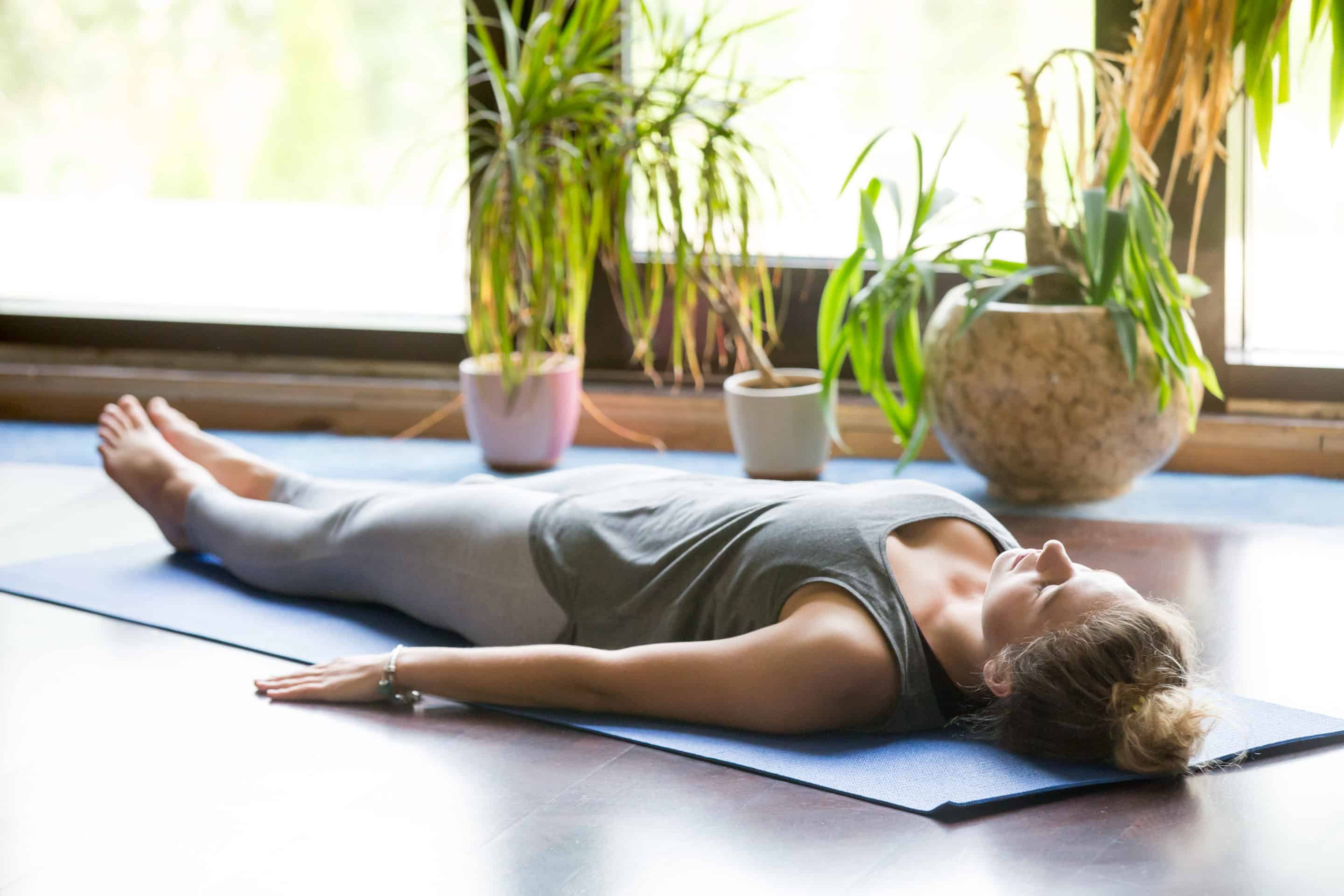 Yoga mat and blanket prepared for Yoga Nidra session