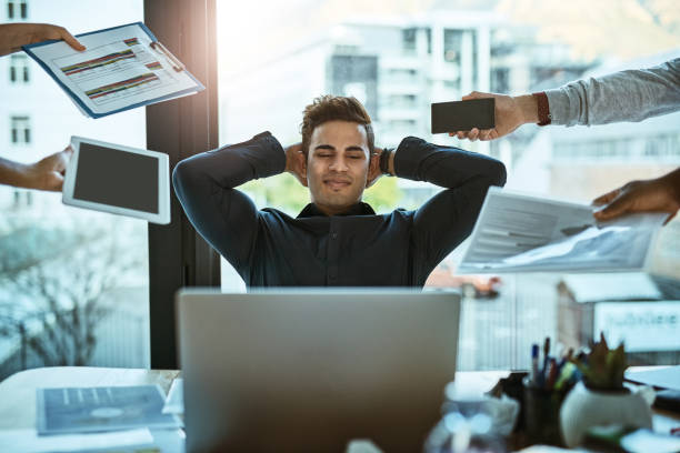 Person pausing mindfully during a busy workday